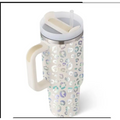 A tall cream-colored pink kiss insulated tumbler with steel handle straw featuring a shimmering leopard print pattern