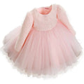A delicate pink lace princess dress girls summer style with long sleeves made of lace and tulle fabric