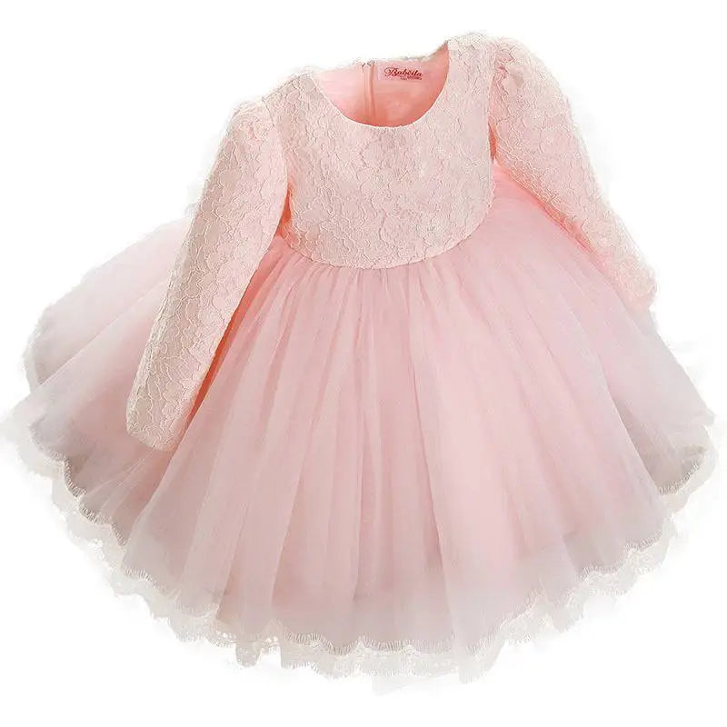 A delicate pink lace princess dress girls summer style with long sleeves made of lace and tulle fabric