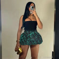 Teal and black leopard print pleated mini skirt with a flared hem featuring ruffled detailing for women