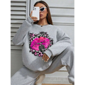Gray oversized crew neck sweatshirt featuring bold pink lips graphic with leopard print and vintage microphone design