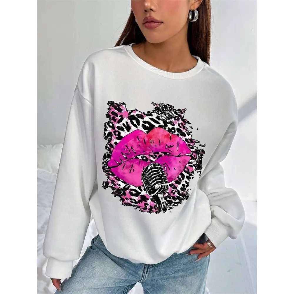 White oversized crew neck sweatshirt featuring pink lips and vintage microphone graphic with black pink leopard print background