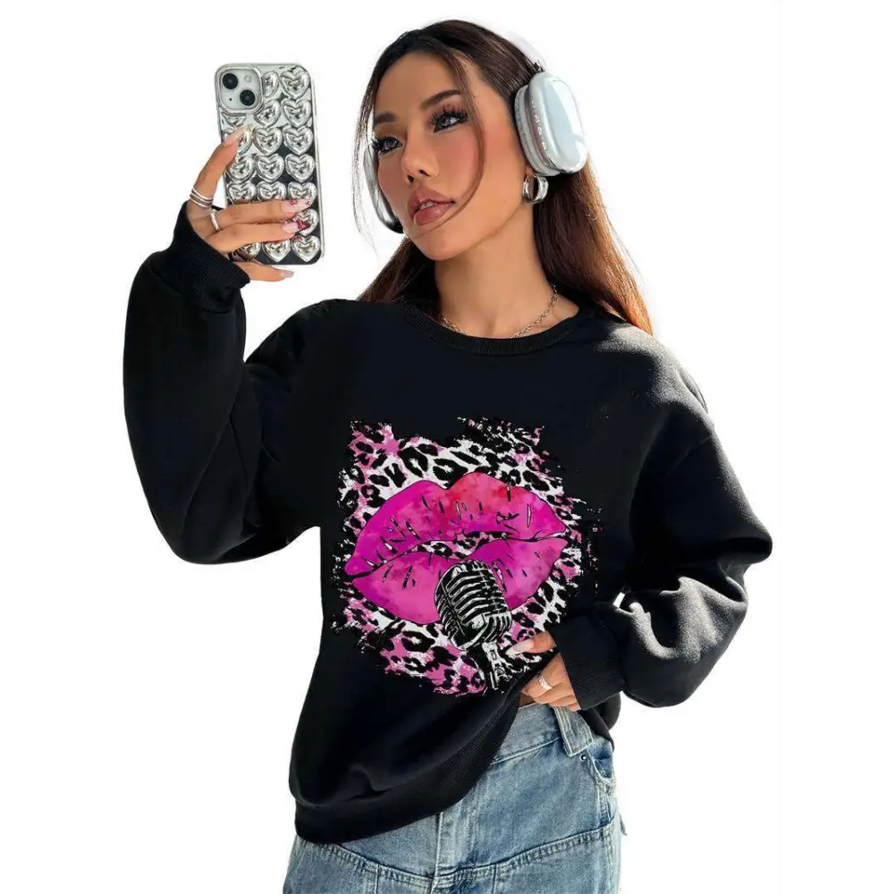 Black oversized crew neck sweatshirt with bold pink lips and leopard print vintage microphone graphic design