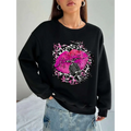 Black oversized crew neck sweatshirt with pink lips and vintage microphone graphic on leopard print background