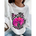White long-sleeved oversized crew neck sweatshirt with pink lips and vintage microphone on black and pink leopard print background