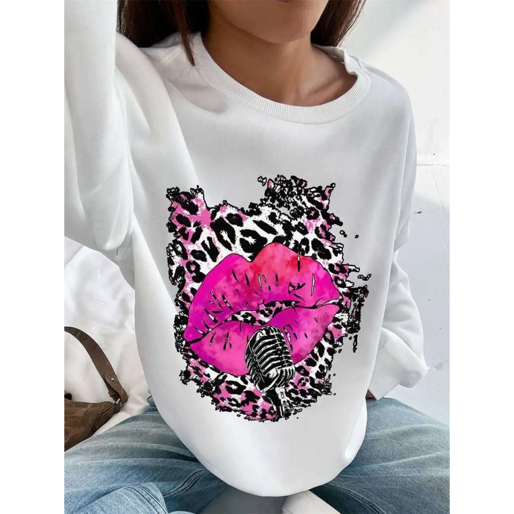White long-sleeved oversized crew neck sweatshirt with pink lips and vintage microphone on black and pink leopard print background