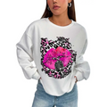White oversized crew neck sweatshirt with pink lips and vintage microphone graphic on black and pink leopard print background