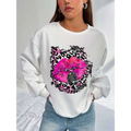 White oversized crew neck sweatshirt with bold pink lips graphic and vintage microphone framed by black and pink leopard print