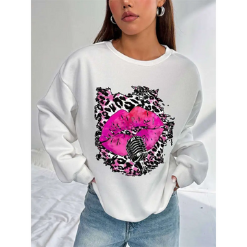 White oversized crew neck sweatshirt with bold pink lips graphic and vintage microphone framed by black and pink leopard print