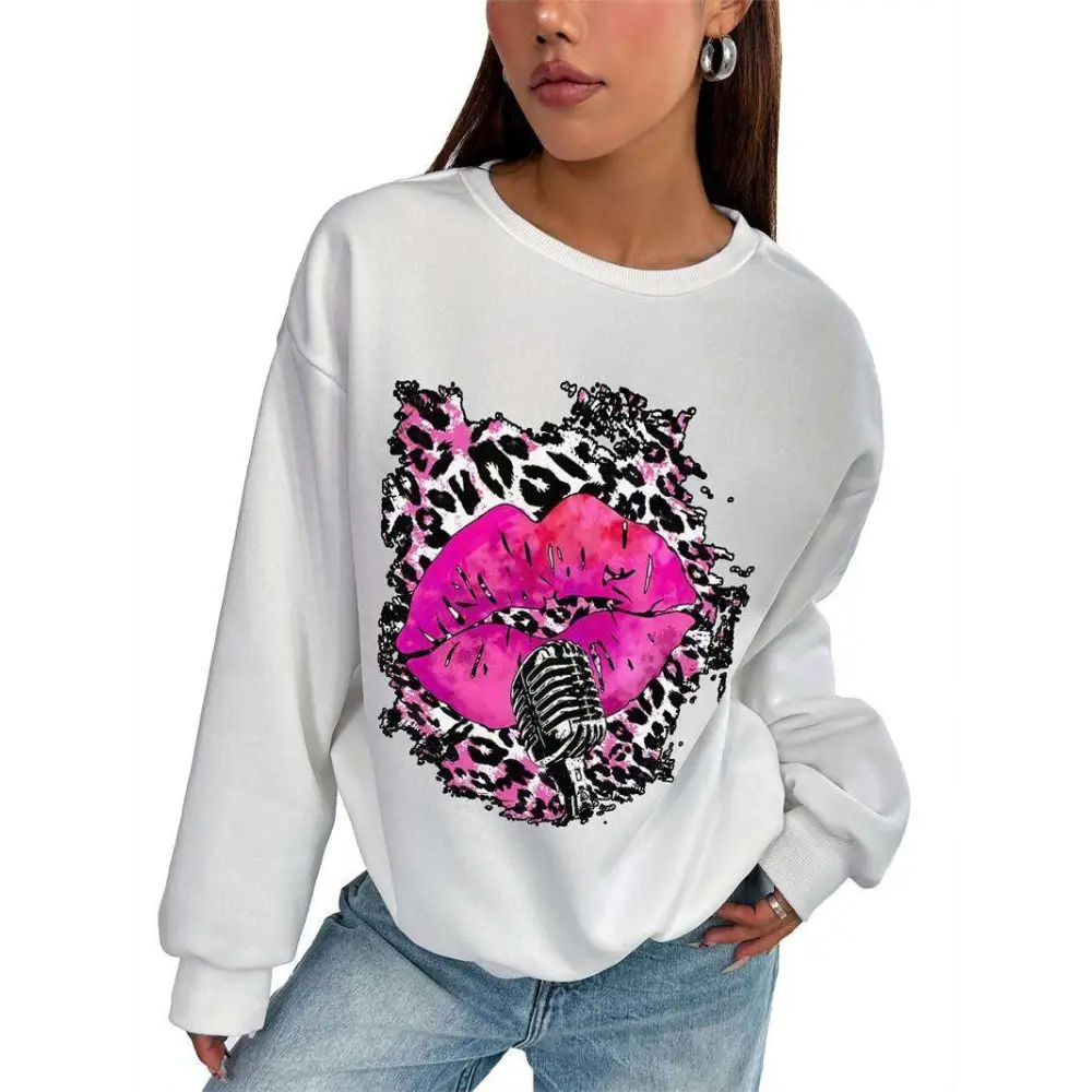 White oversized crew neck sweatshirt with pink lips and vintage microphone graphic on splattered leopard print background
