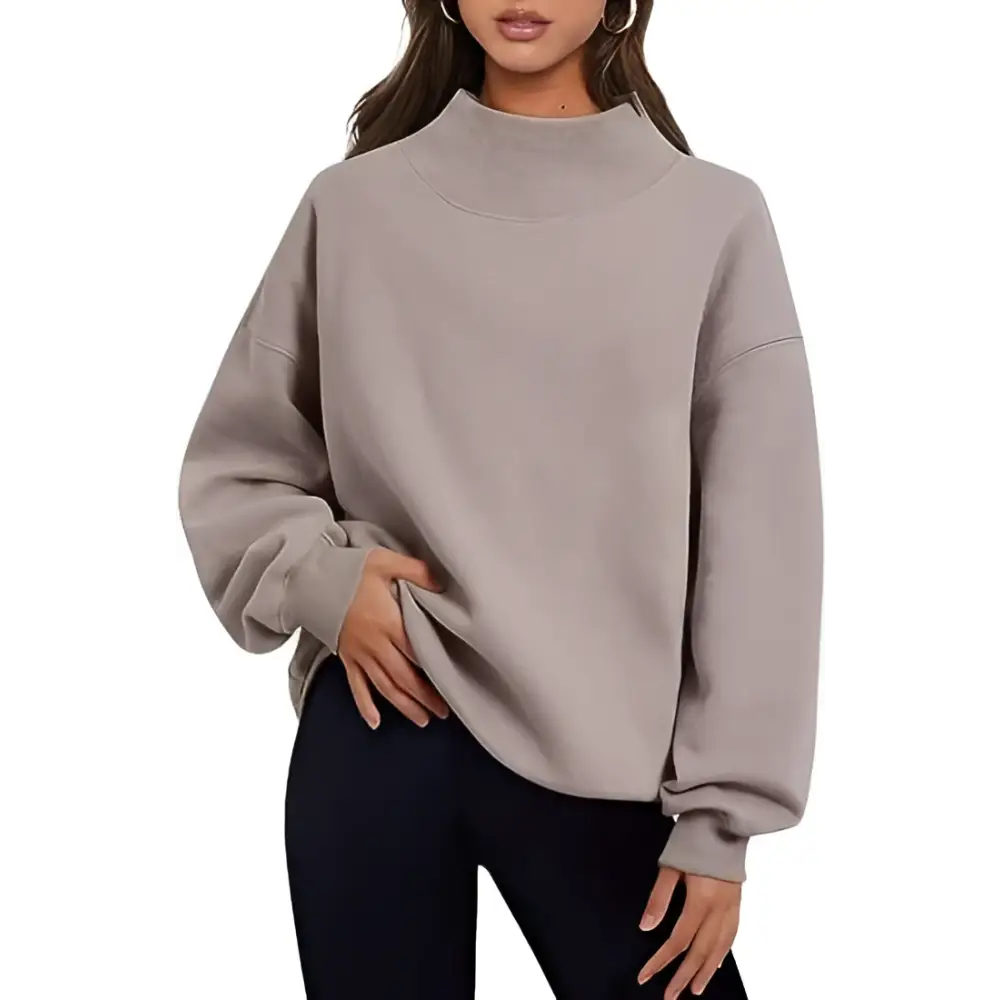 A soft muted gray pullover sweatshirt solid with pink oversized turtleneck and ribbed cuffs in relaxed fit