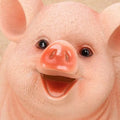 A cheerful pink pig piggy bank with glossy snout and textured skin made of plastic money box for saving coins