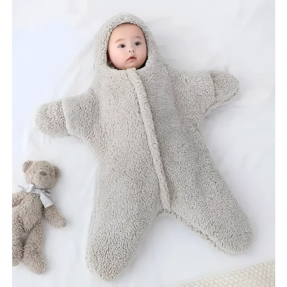A soft plush gray star fleece baby quilt sleeper with hood and front zipper for comfortable infant use