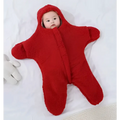 A soft plush red star fleece baby quilt sleeper onesie with hood and full-length sleeves for infants
