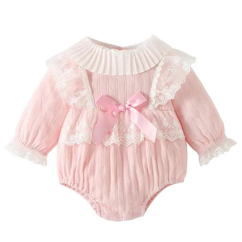 Pink ribbed long sleeve newborn clothes jumpsuit with lace trim and satin bow in delicate pink ribbed fabric