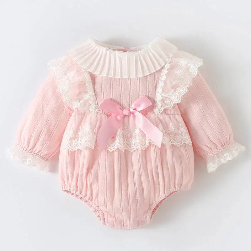 Pink ribbed long sleeved newborn clothes jumpsuit with lace trim white ruffles and matching pink satin bow at front