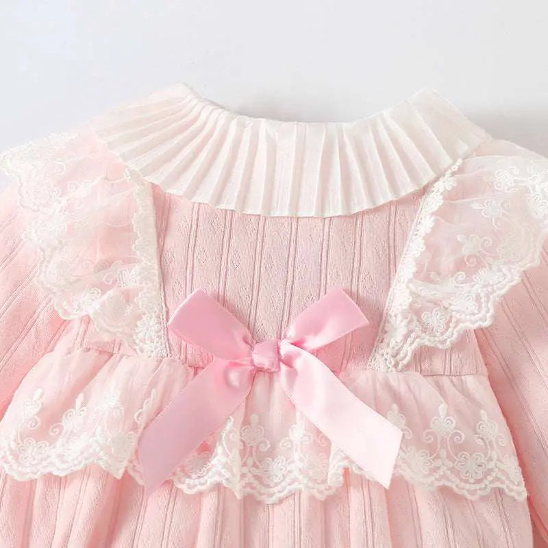 Delicate pink ribbed long sleeve newborn clothes jumpsuit with pleated white lace collar and lace trim details