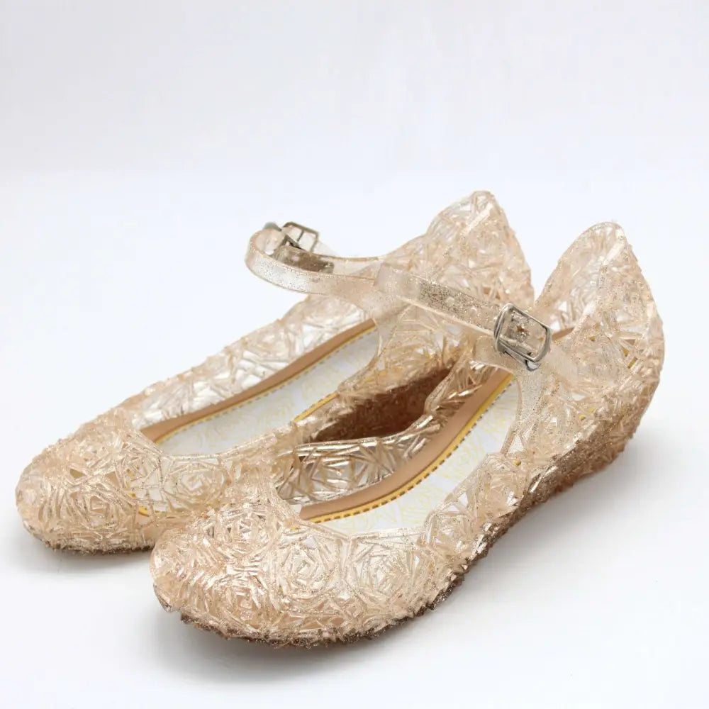Transparent gold-colored jelly flats with rose pattern and metallic buckle straps for pink rose girls crystal shoes
