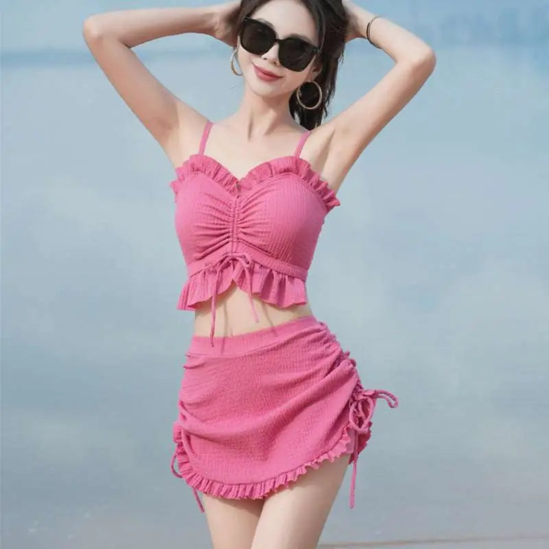 Pink ruffled fashion two-piece split swimsuit featuring textured fabric and side ties for a fashion personality bikini look