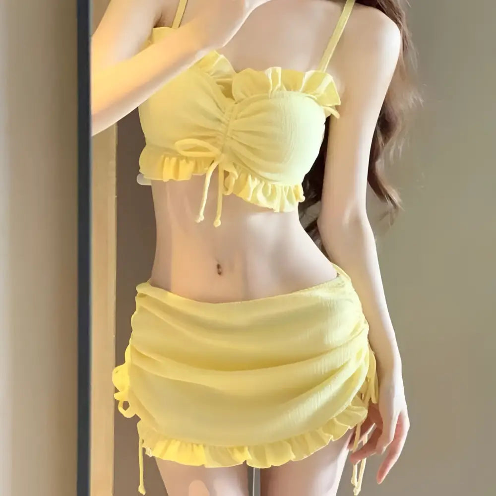 Yellow ruffled fashion personality bikini set with textured fabric and matching drawstring ties in split swimsuit featuring pink ruffles