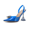 Vibrant blue patent leather slingback pump featuring a transparent flared heel and silver crystal embellishment at toe