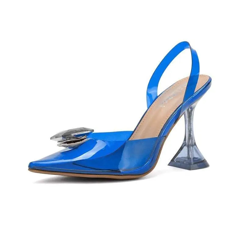 Vibrant blue patent leather slingback pump featuring a transparent flared heel and silver crystal embellishment at toe