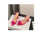 Pink satin bow women’s high-heeled sandal featuring transparent pink straps and crystal-like square toe embellishment