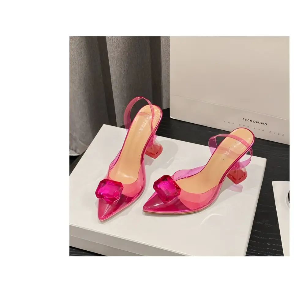 Pink satin bow women’s high-heeled sandal featuring transparent pink straps and crystal-like square toe embellishment