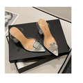 Pink satin bow high-heeled sandal featuring clear acrylic mules with transparent heel and square crystal buckle at toe
