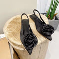 Black satin floral embellished slingback flats with rose accents for elegant pink satin floral embellished style
