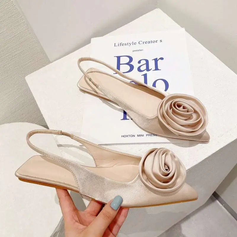 Beige satin floral embellished backless flat sandal with a delicate rose embellishment on the toe