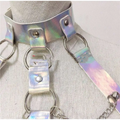 Iridescent metallic choker with attached straps and rings complementing a pink sequined fringe night club dress