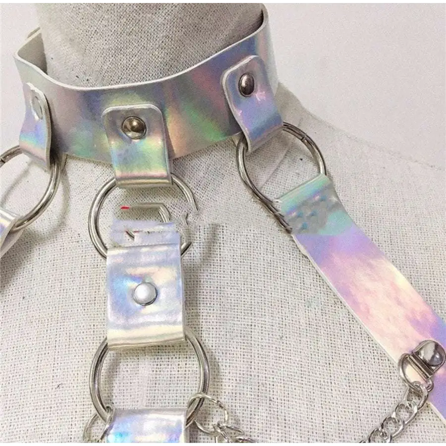 Iridescent metallic choker with attached straps and rings complementing a pink sequined fringe night club dress