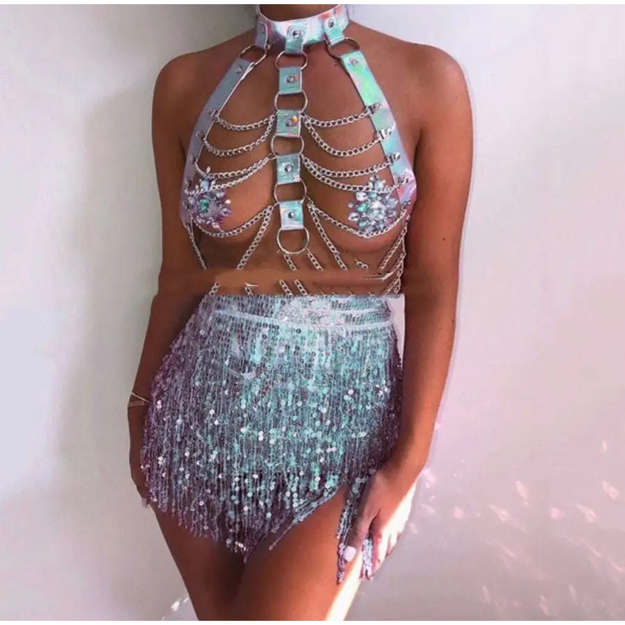 A pink sequined fringe night club mini skirt with iridescent sequins paired with a metallic chain leather harness top