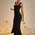 Elegant black lace mermaid gown with a fitted bodice and flowing skirt featuring a ruched bodycon fit design