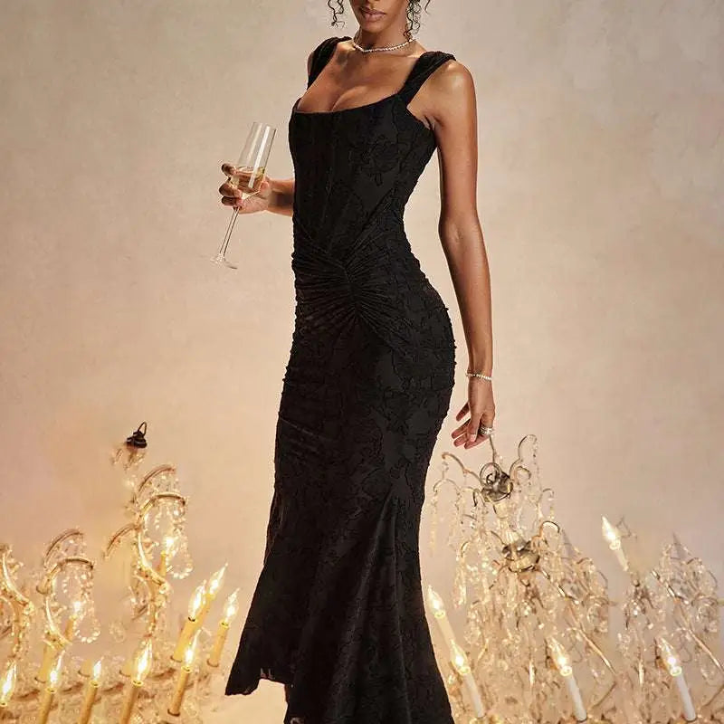 Elegant black lace mermaid gown with a fitted bodice and flowing skirt featuring a ruched bodycon fit design