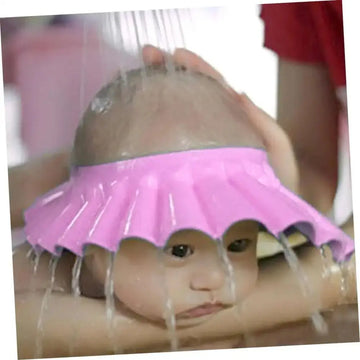 Pink silicone kids bathing hat with adjustable ruffled edge for wash hair protection during bath time