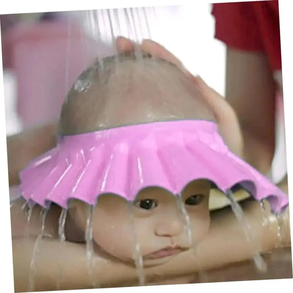 Pink silicone kids bathing hat with adjustable ruffled edge for wash hair protection during bath time