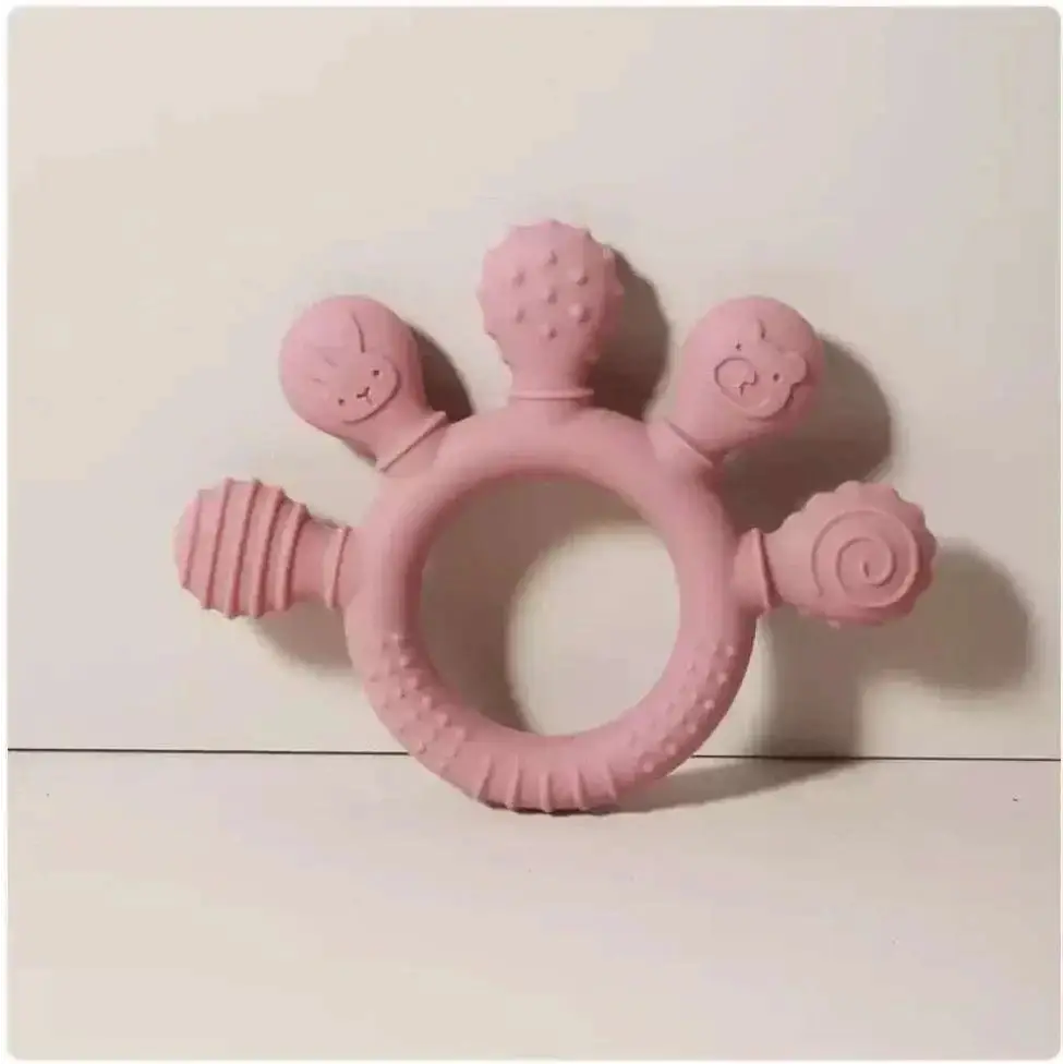 Pink silicone baby hand teether with cute animal shapes and textured designs for soothing gums