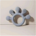 Gray silicone baby hand teether with textured rounded protrusions featuring dots and swirls for soothing gums
