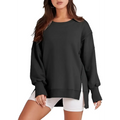 Black oversized sweatshirt crew with side slits and ribbed cuffs complementing a pink solid oversized crew neck design
