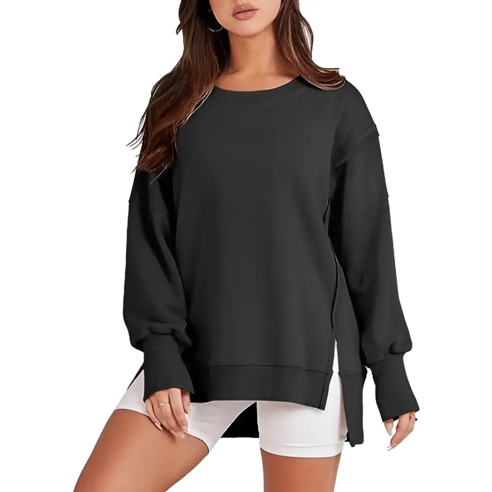 Black oversized sweatshirt crew with side slits and ribbed cuffs complementing a pink solid oversized crew neck design