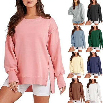 Pink solid oversized sweatshirt crew with a relaxed fit and side zipper detail featuring a crew neck design