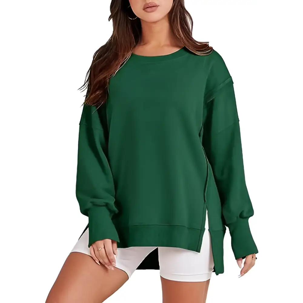 Dark green oversized sweatshirt crew with side slits and a relaxed fit, contrasting the pink solid oversized crew neck design