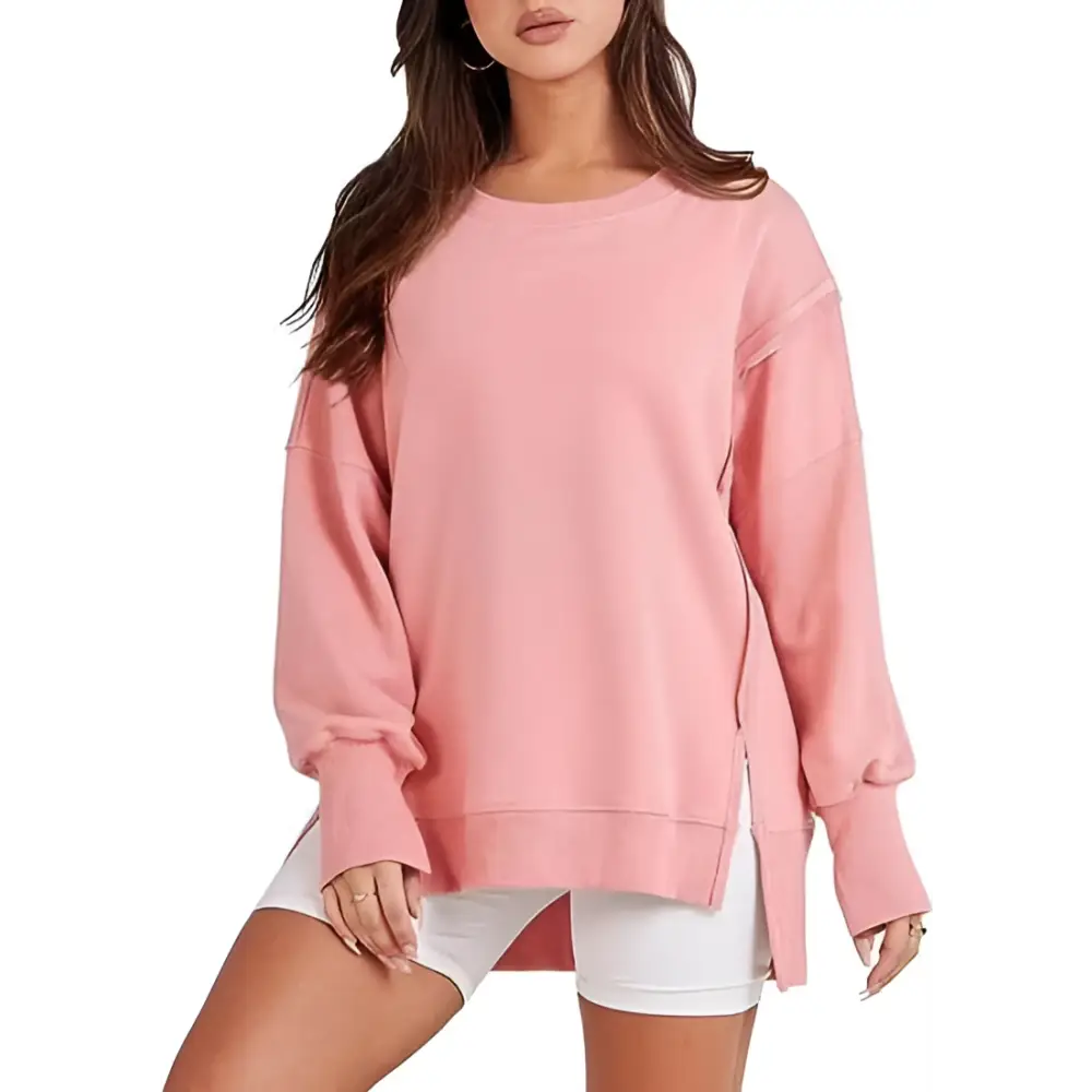 Pink solid oversized sweatshirt with crew neck design and side zippers for a relaxed fit and casual wear