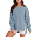 Light blue oversized sweatshirt crew neck design with side slits and relaxed fit complementing pink solid oversized style