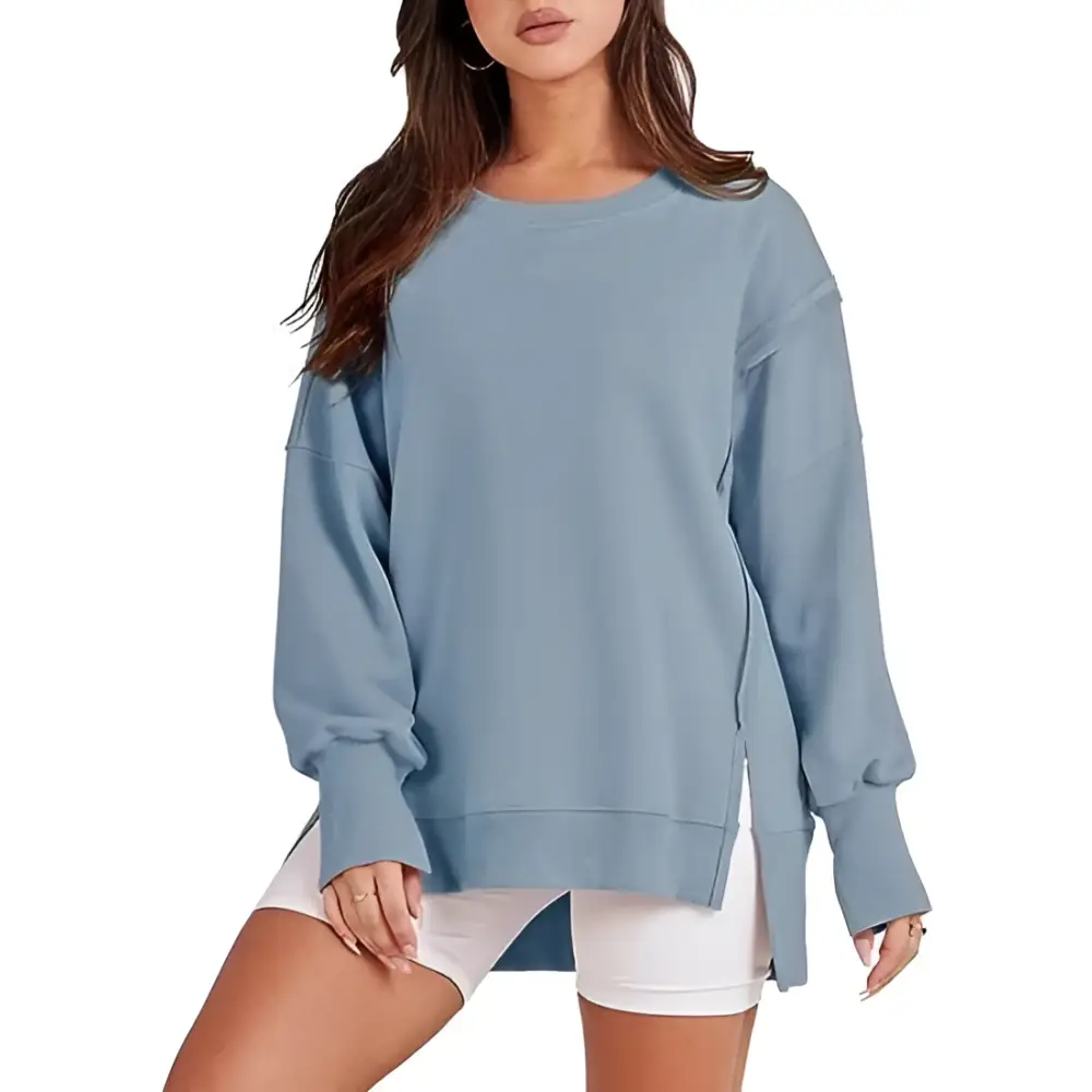 Light blue oversized sweatshirt crew neck design with side slits and relaxed fit complementing pink solid oversized style