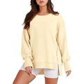 A soft pale yellow oversized sweatshirt crew neck design with relaxed fit and side slit detailing for casual wear
