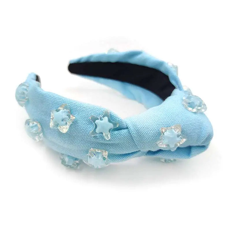 Light blue knotted fabric holiday party headband with clear and light blue star embellishments pink star solid cute hairware