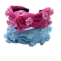Pink and blue knotted holiday party headbands adorned with clear star-shaped embellishments pink star solid cute hairware